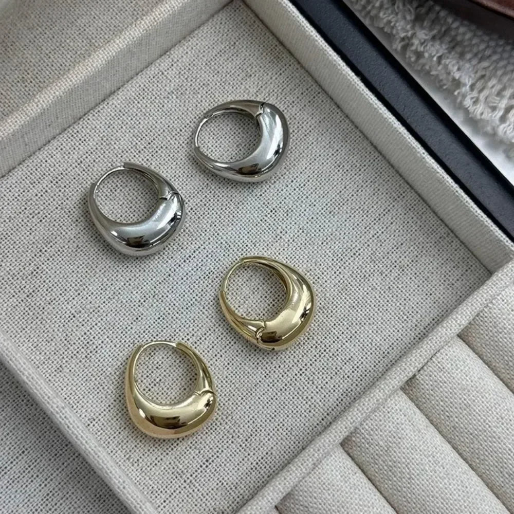 Argolas Grossas – Brilho Intenso em Aço Inoxidável